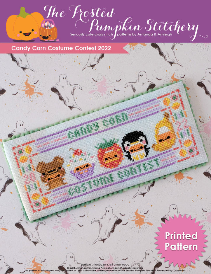 Image of Candy Corn Costume Contest 2022 counted cross stitch pattern. Five little candy corns are in costumes. From left to right they are dressed as a teddy bear, cupcake, strawberry, penguin and banana.